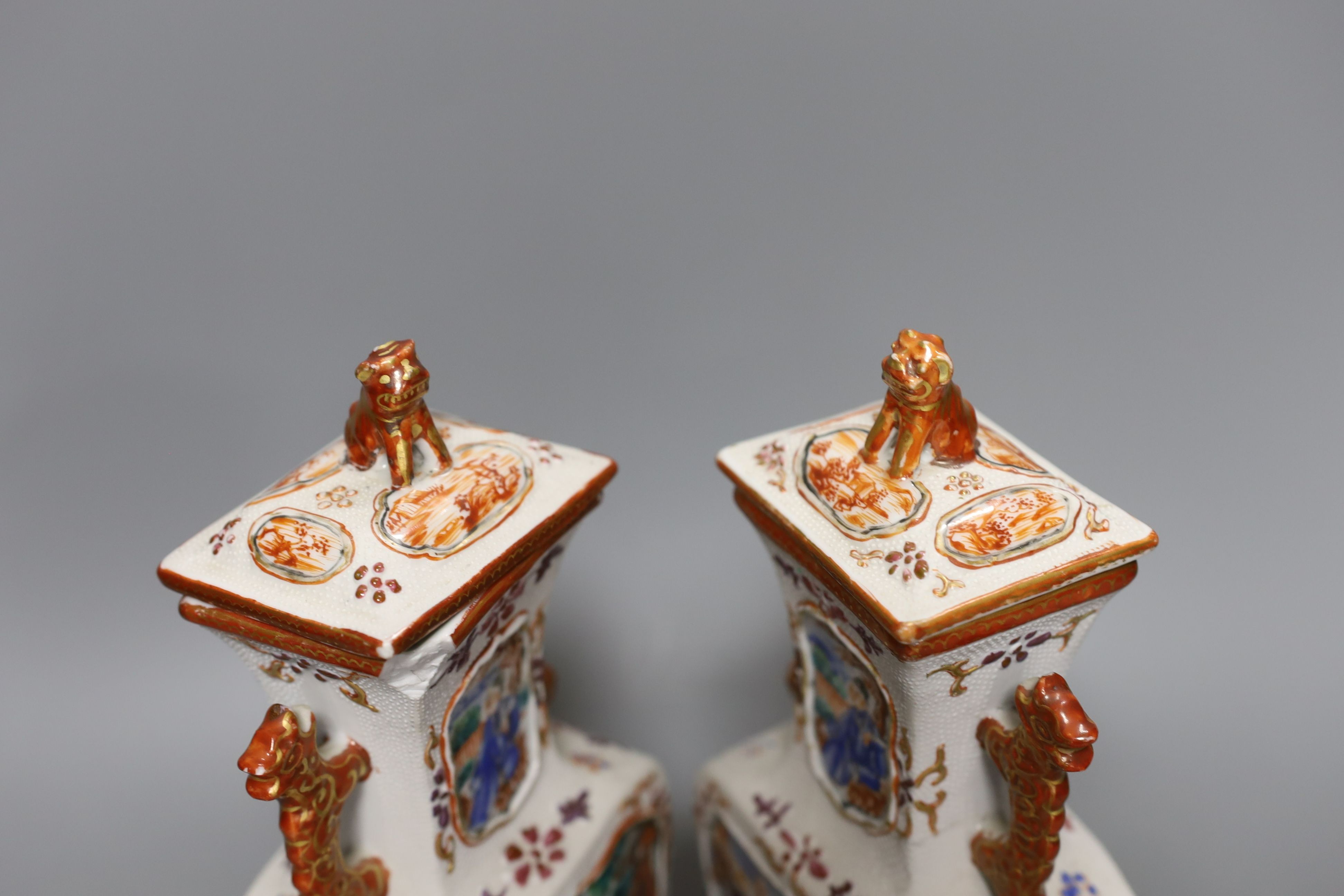 A pair of 18th century Chinese export square form famille rose vases and covers with phoenix handles - 24.5cm tall